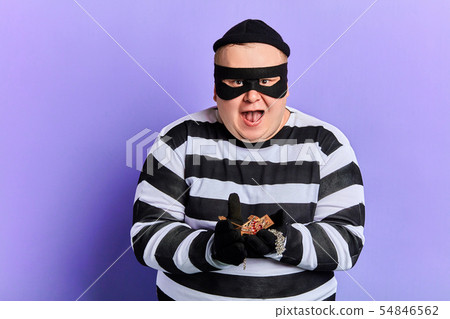 fat happy excited burglar holding jewel in palms and looking at the camera 54846562