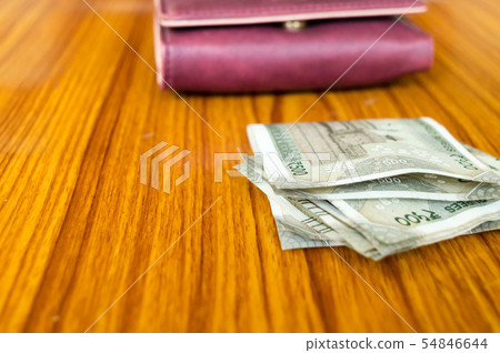 Indian Currency rupee cash note in leather wallet 54846644