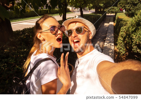 cute couple makes selfie on the street cute couple makes selfie on the street 54847099
