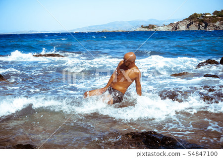handsome man on the marine rocky shore handsome man on the marine rocky shore 54847100
