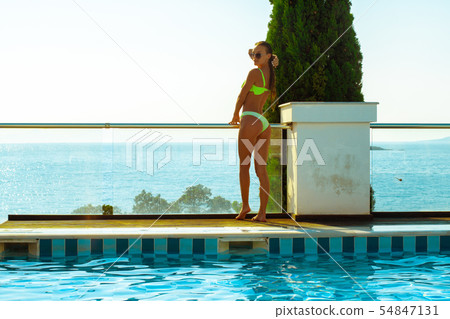 Gorgeous girl at the pool posing 54847131