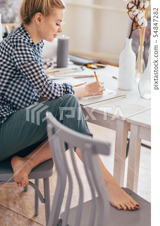 amorous girl writing a letter to her boyfriend. amorous girl writing a letter to her boyfriend. 54847282