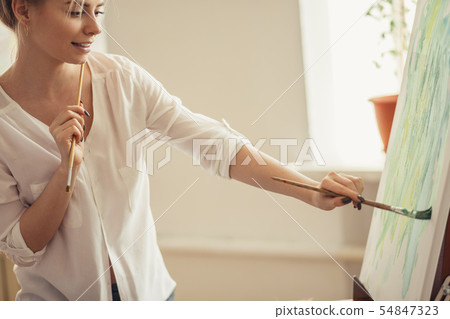 young cheerful nice girl making up a paint young cheerful nice girl making up a paint 54847323
