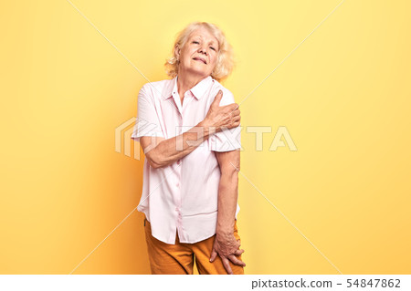 old mature attractive wman showing her shouler dislocation 54847862