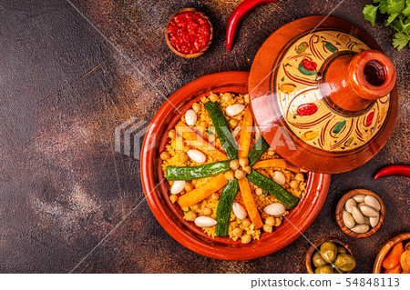 Vegetable tagine with almond and chickpea couscous Vegetable tagine with almond and chickpea couscous 54848113