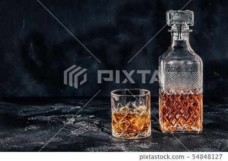 Glass of the whiskey with a square decanter Glass of the whiskey with a square decanter 54848127