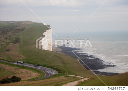 White chalk cliffs and Beachy Head Lighthouse. Eastbourne, East Sussex, England. Highest chalk sea White chalk cliffs and Beachy Head Lighthouse. Eastbourne, East Sussex, England. Highest chalk sea 54848717