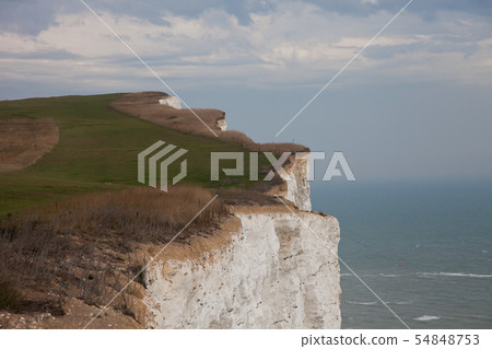 White chalk cliffs and Beachy Head Lighthouse. Eastbourne, East Sussex, England. Highest chalk sea 54848753