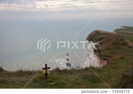 White chalk cliffs and Beachy Head Lighthouse. Eastbourne, East Sussex, England. Highest chalk sea White chalk cliffs and Beachy Head Lighthouse. Eastbourne, East Sussex, England. Highest chalk sea 54848755