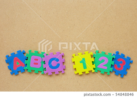 Alphabet puzzle with number puzzle on wooden Alphabet puzzle with number puzzle on wooden 54848846