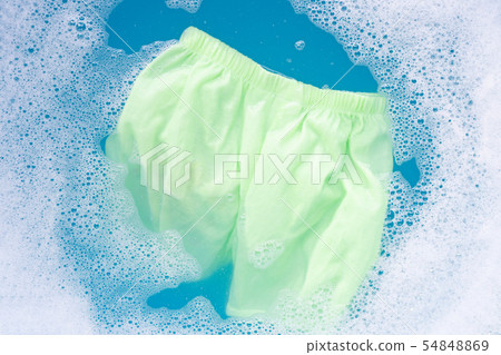Green baby shorts soak in water Green baby shorts soak in water 54848869