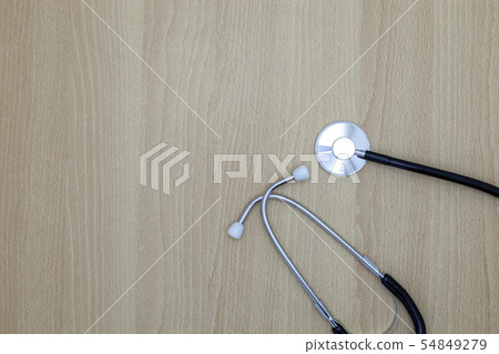 Stethoscope on wood background, medical background Stethoscope on wood background, medical background 54849279