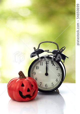 Clock with spider for Halloween celebration 54850699