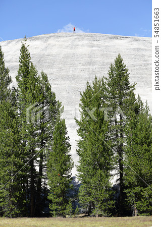 Hero man reaching summit on top of mountain 54851663
