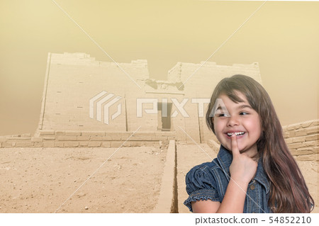 Smiling little girl is standing in front of Temple Smiling little girl is standing in front of Temple 54852210