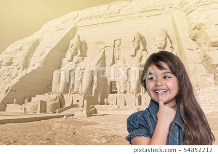 Smiling little girl is standing in front of Abu 54852212