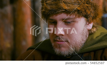 Portrait of man in russian ethnic suit playing chess Portrait of man in russian ethnic suit playing chess 54852587