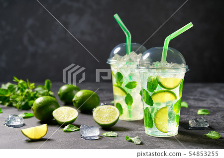 Refreshing cocktail mojito  with lime slices, ice 54853255