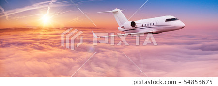 Small private jetplane flying above beautiful clouds. 54853675