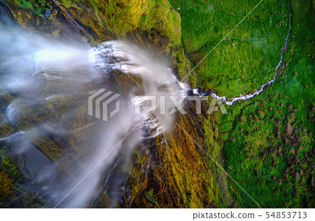 Beautiful top view of waterfall in Iceland during Sunset. Beautiful top view of waterfall in Iceland during Sunset. 54853713