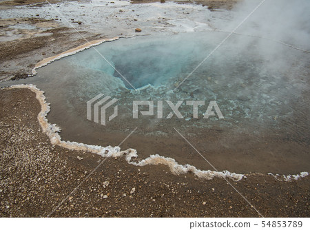 The crystal clear water from a geothermal spring 54853789