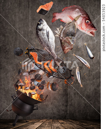 Kettle grill with fire flames, cast iron grate and tasty sea fishes flying in the air. Kettle grill with fire flames, cast iron grate and tasty sea fishes flying in the air. 54853923