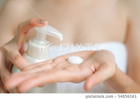 Woman applying moisturizing cream/lotion on hands. Woman applying moisturizing cream/lotion on hands. 54856161