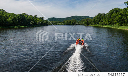inflatable motor boat. fishing boat on a mountain river. Anyui River. Khabarovsk territory, far East 54857237