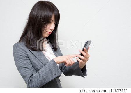 A woman with a smartphone A woman with a smartphone 54857311