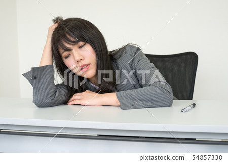 Tired sitting woman 54857330