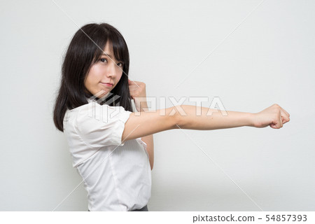 Woman straightening the right Woman straightening the right 54857393