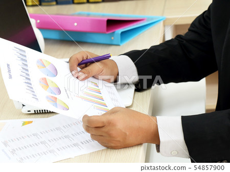 businessman working his job at the office 54857900