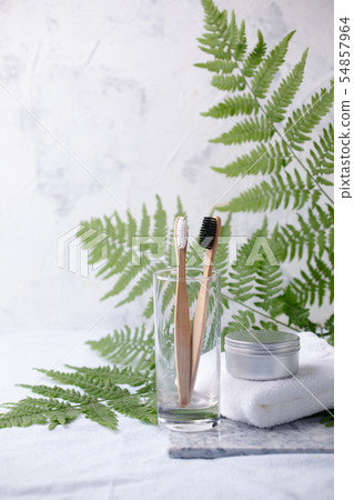 Homemade toothpaste in metal jar, bamboo Homemade toothpaste in metal jar, bamboo 54857964