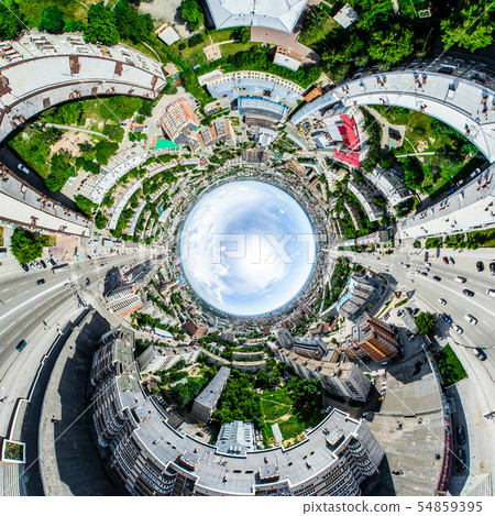 Aerial city view with crossroads and roads, houses, buildings, parks and parking lots. Sunny summer 54859395