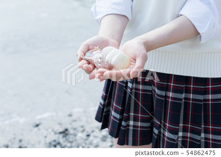 High school girl hand shell 54862475