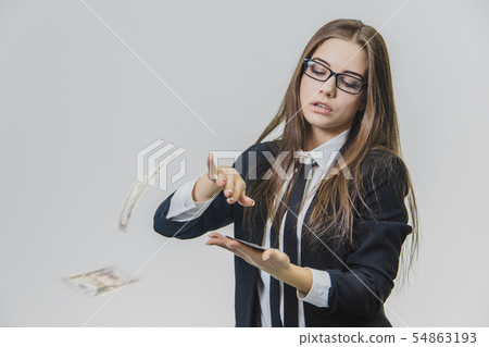 Adorable excited young business woman is throwing a pile of money, isolated on white background Adorable excited young business woman is throwing a pile of money, isolated on white background 54863193