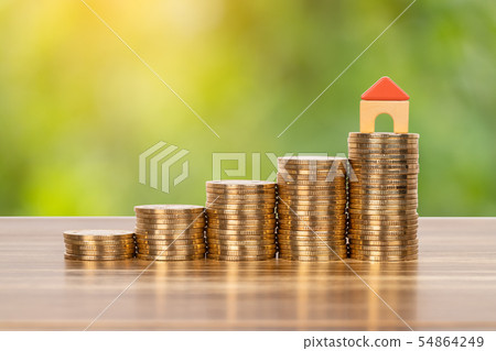 Mini model house on coins stack concept for Mini model house on coins stack concept for 54864249