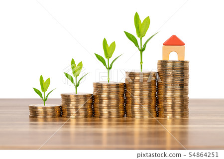 Mini model house on coins stack concept for 54864251