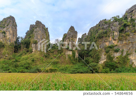 Beautiful limestome mountain range at Ban Mung Beautiful limestome mountain range at Ban Mung 54864656