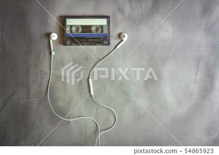 Old cassette with ear phones Old cassette with ear phones 54865923