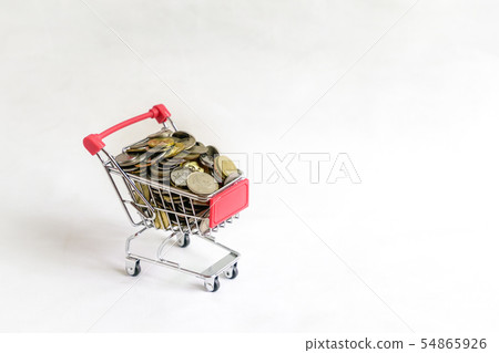 Metal coins in a mini shopping cart 54865926