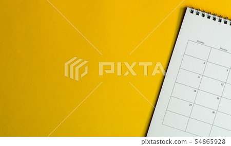 Top view of calendar or planner on an office desk Top view of calendar or planner on an office desk 54865928
