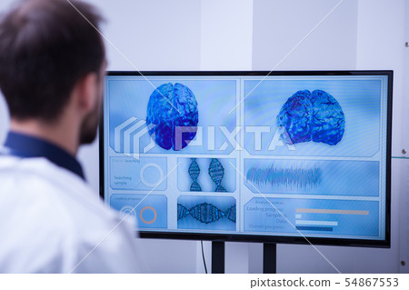 Young resident in a hospital learning about brain inovations in medicine 54867553