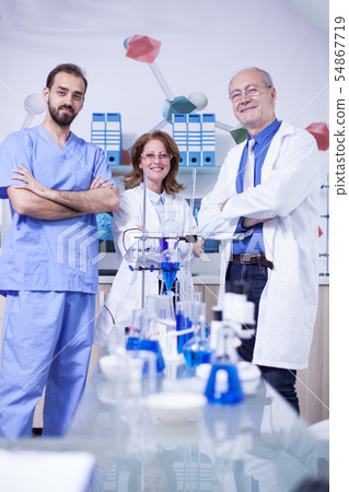 Portrait of researchers team with arms crossed smiling to the camera 54867719