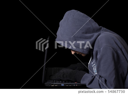 Hacker on a laptop.Concept of internet criminal Hacker on a laptop.Concept of internet criminal 54867730