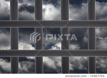 Prison window cell and cloudy sky 54867769