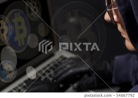 Crypto Hacker with laptop and bitcoin .Concept of 54867792