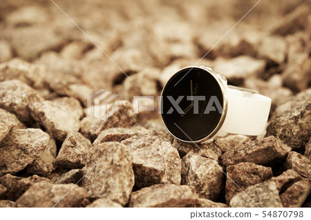 Sport watch for triathlon on the granite gravel 54870798