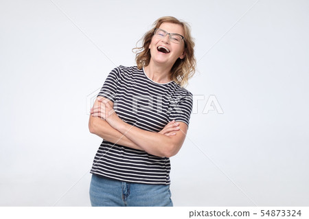 Laughing mature european woman having positive facial emotion on face. 54873324