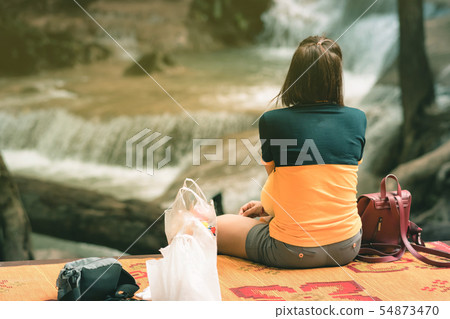 Back view of Female tourist is resting at Erawan 54873470